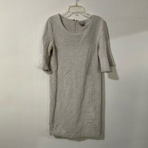 Grey dress with 3/4 sleeves, featuring a relaxed fit and a subtle sheen.